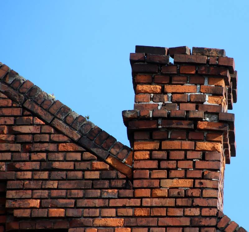 Signs Your Royal Oak Home Needs a Chimney Inspection Damaged chimney on an Royal Oak home showing cracks and missing mortar